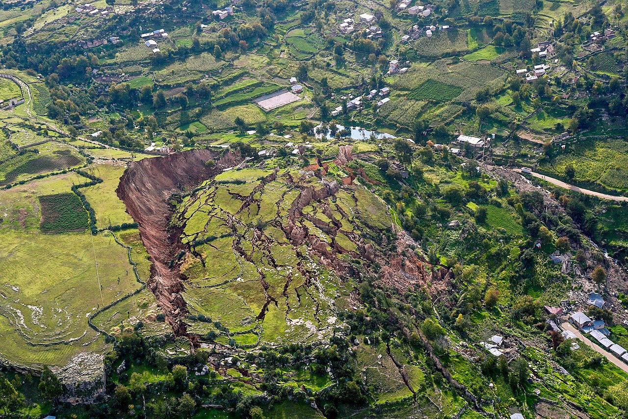 A big pile of rocks and mud slides down a hill in Peru.