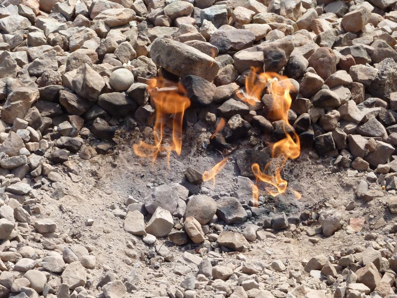 Natural flames burn from hot gas seeping up from the ground.