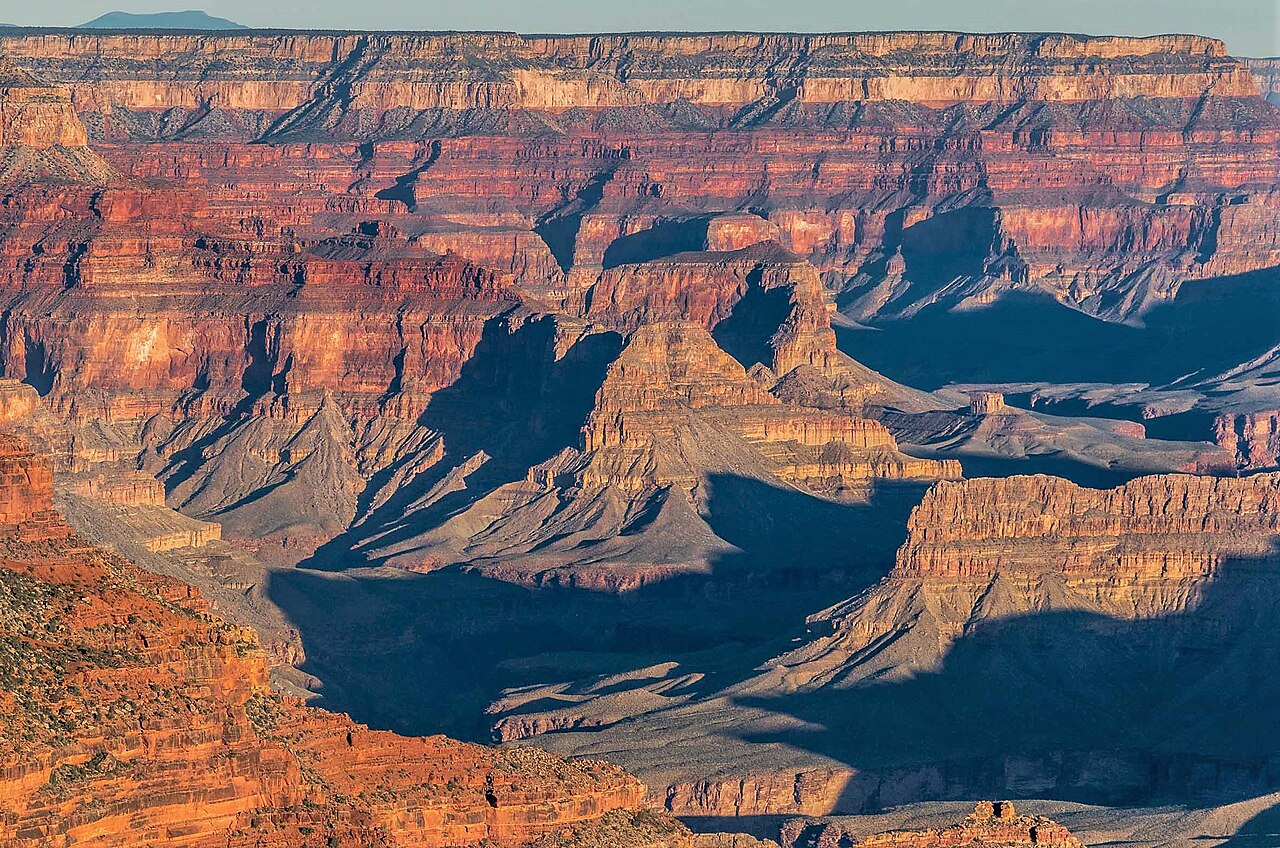 Tall rocky peaks rise up inside the Grand Canyon.