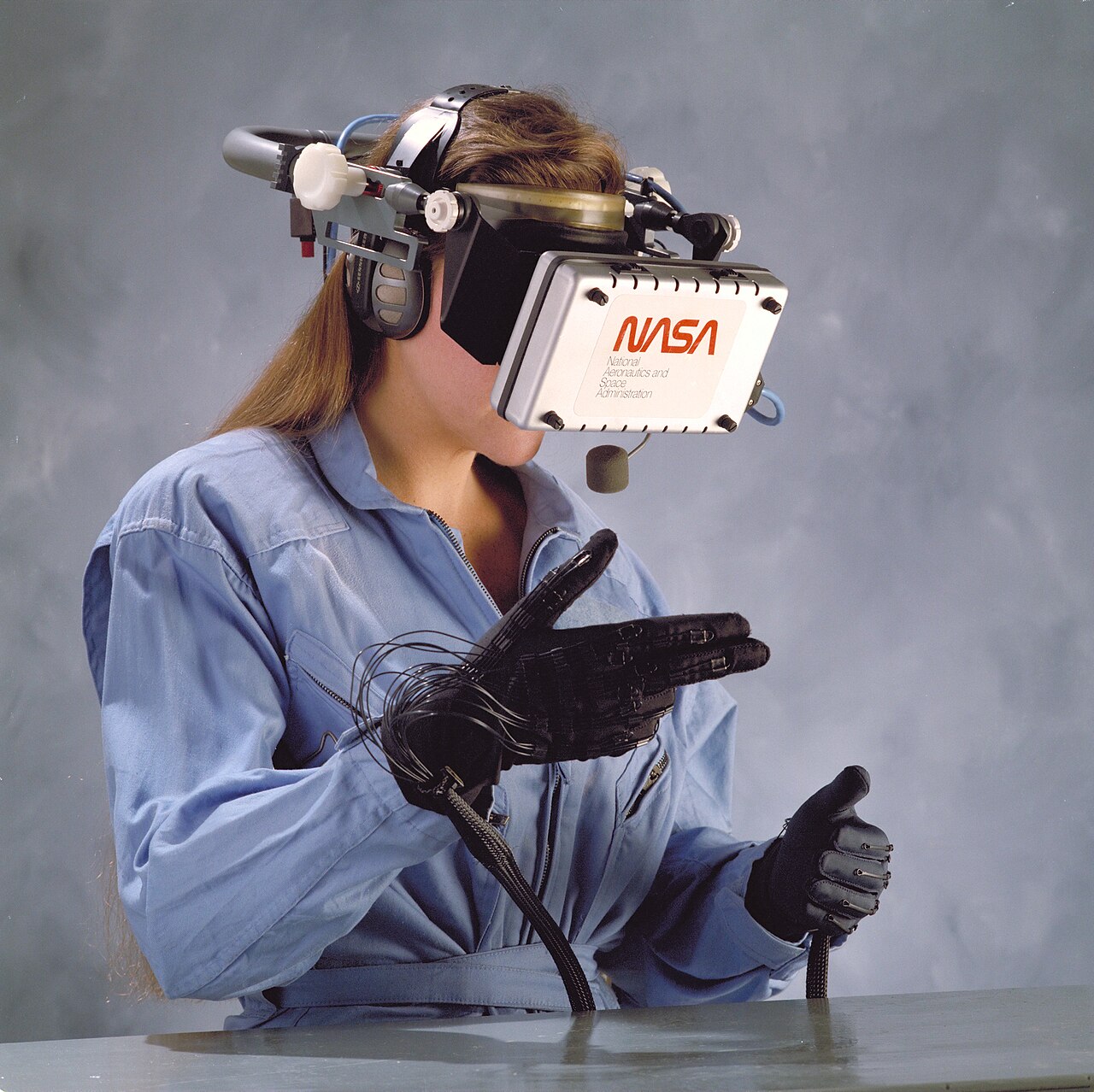 A person wears special gloves to play in a virtual world.