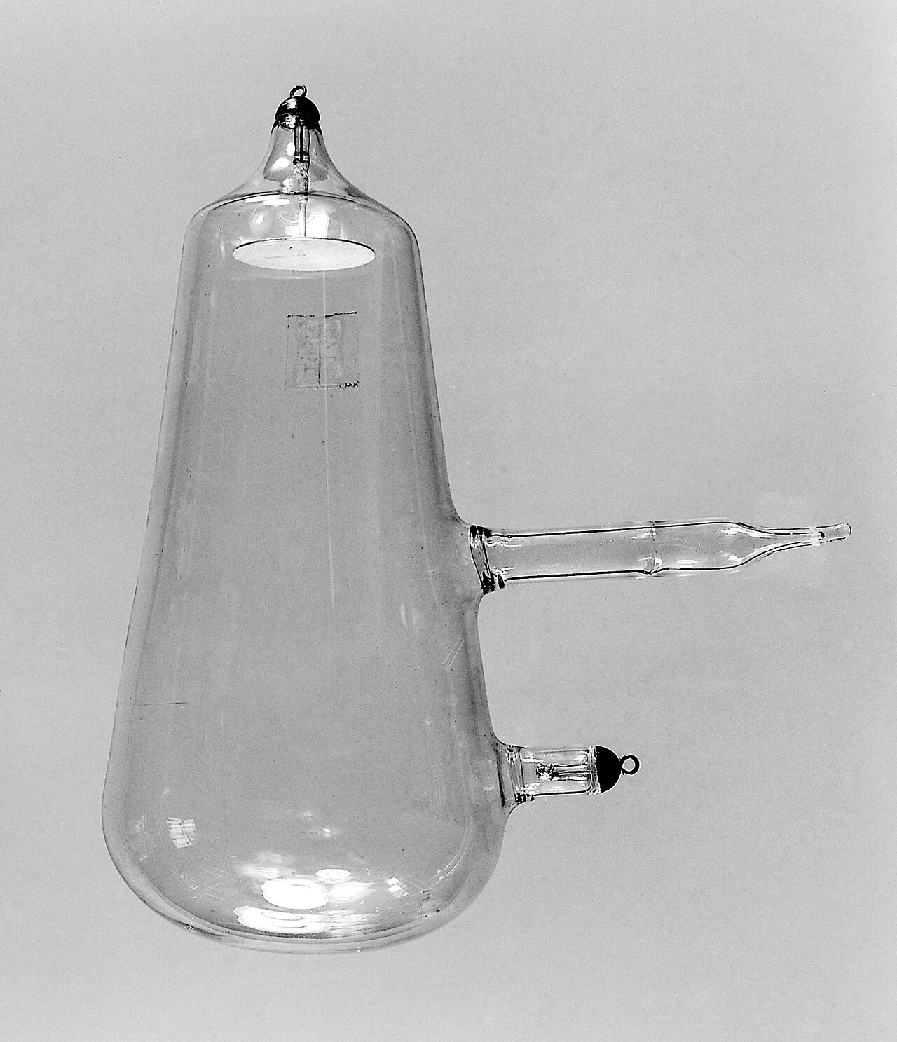 An old glass tube used to show how x-rays travel in straight lines.