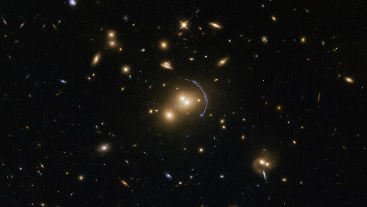 A Hubble telescope picture showing faraway galaxies glowing in deep space.