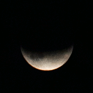 An animation showing the Moon slowly turning red during a lunar eclipse.