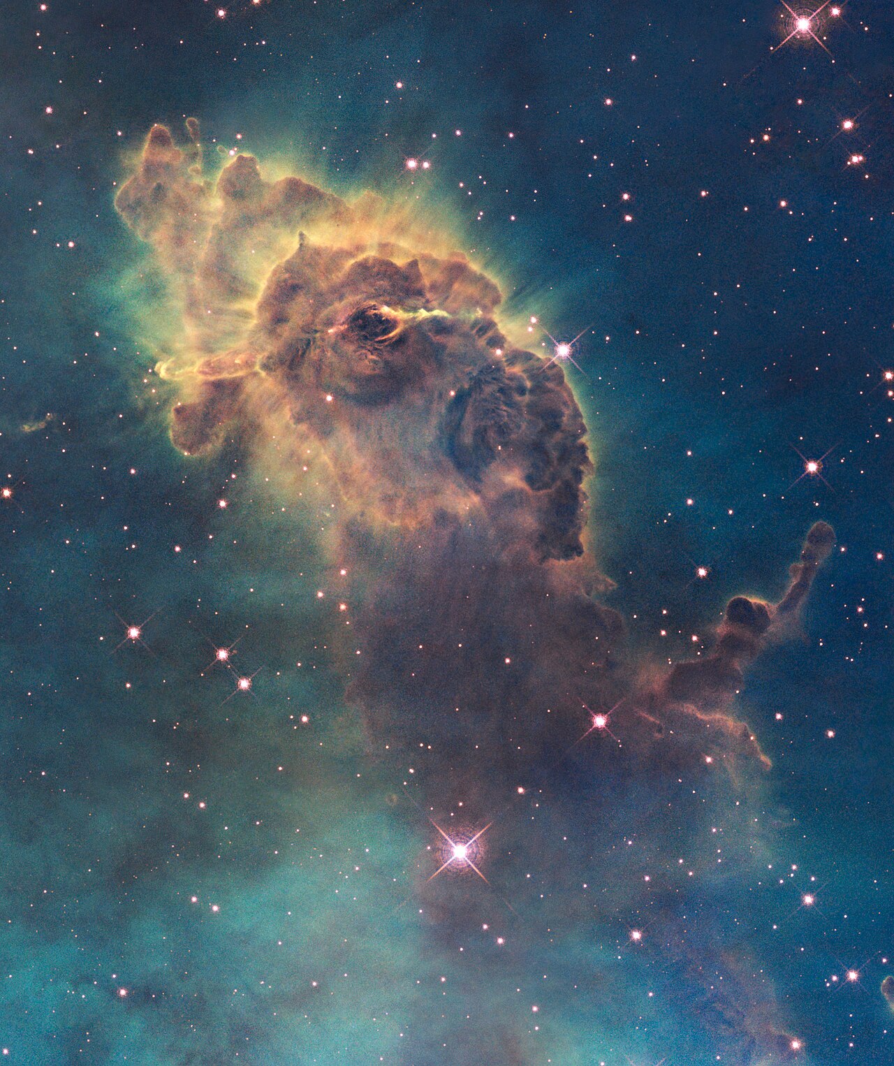 A tall, glowing pillar of gas and dust where new stars are being born.