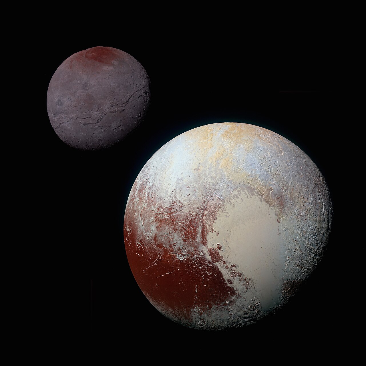 Pluto and its moon Charon, two icy worlds out past Neptune.