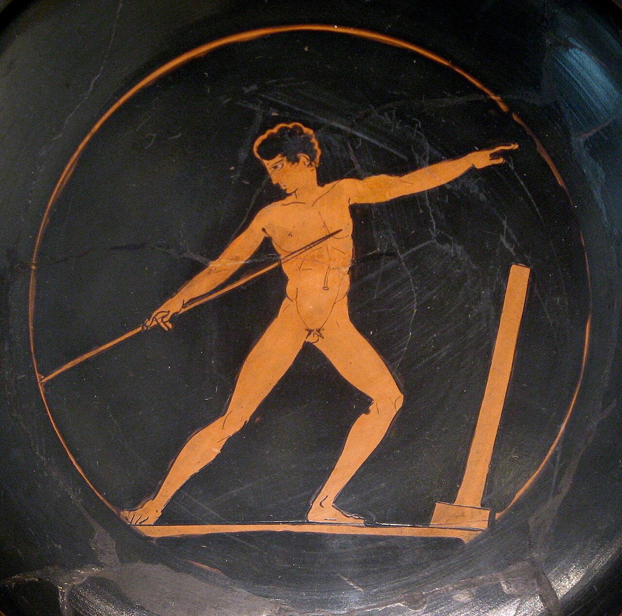 An ancient Greek cup painted with an athlete throwing a javelin.