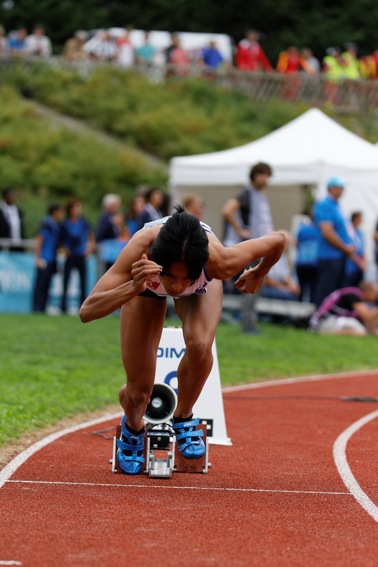 Sprinters burst out of the blocks at the start of a race.