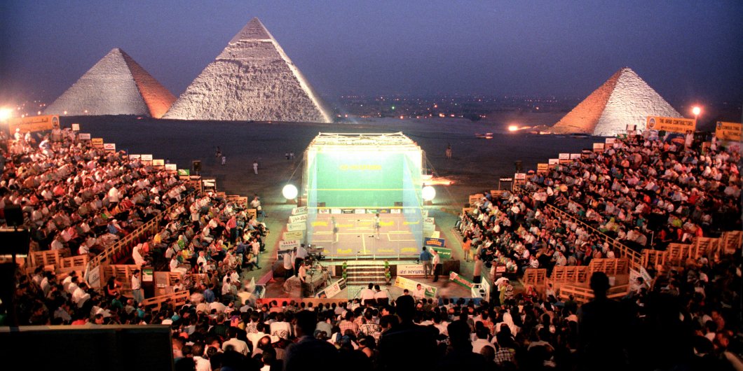 Players enjoy a fun squash match near the pyramids of Egypt.