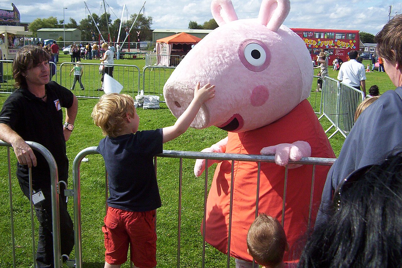 Peppa Pig waves hello to her many happy fans.