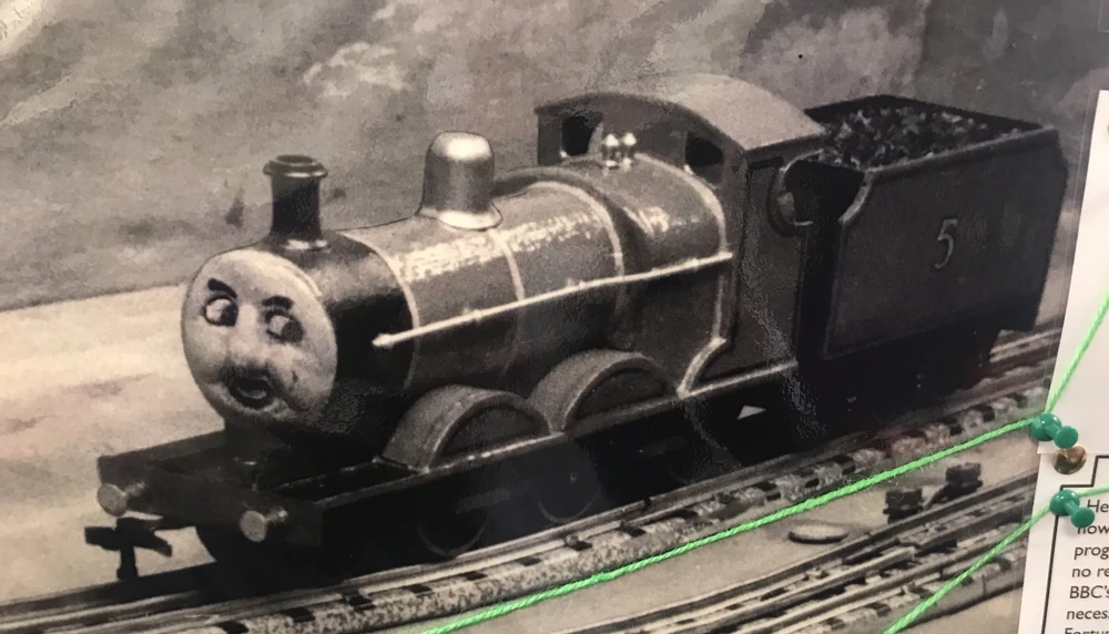 A small model of a Thomas and Friends train engine.